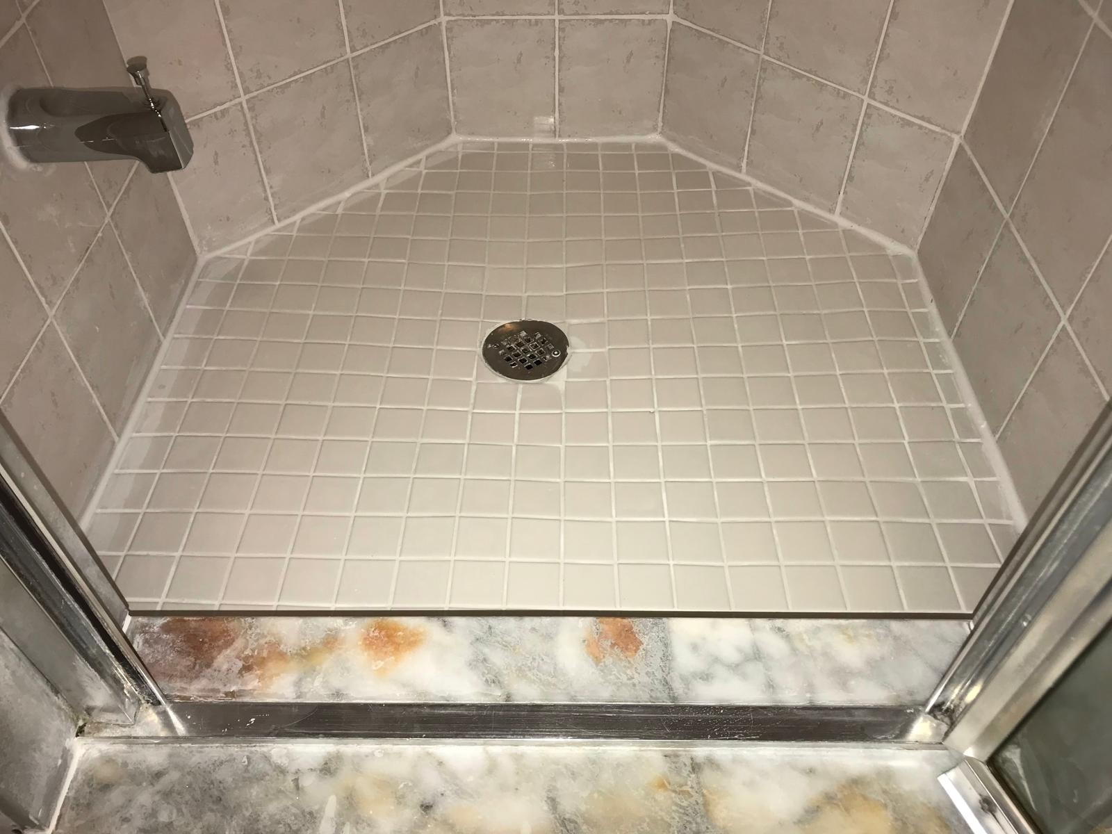 Full shower floor after restoration — clean white grout lines — TilesRus Toronto